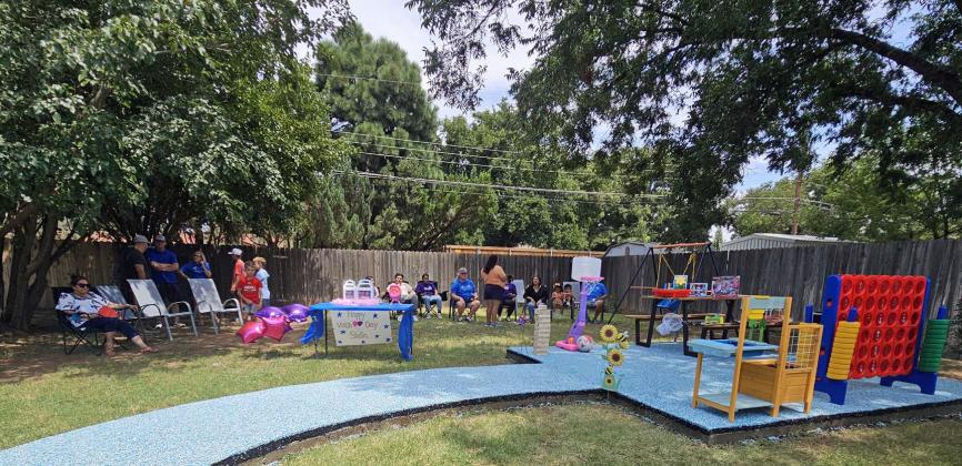 Stella Duran and her parents, Michael and Olivia Duran walk out in to their backyard to reveal Stella’s Make-A-Wish on Saturday, August 9th. They were surrounded by family and friends for the special event. (Staff Photos by Derek Lopez)