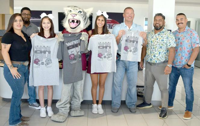 READY FOR WAR ON 84 -- Littlefield Cheer and Wildcat Mascot, join the staff of Premiere Chevrolet Buick of Littlefield to distribute free War on 84 T shirts to Littlefield and Muleshoe fans on Thursday, August 24, 2023. (Photo by Ann Reagan)