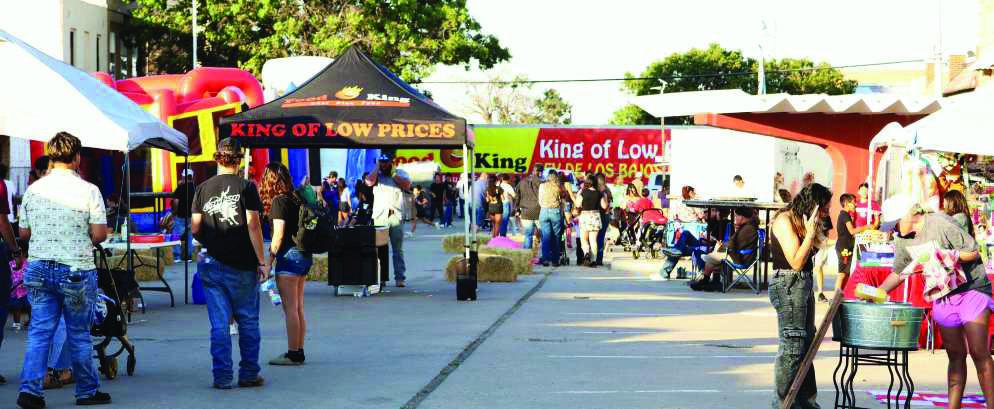 DOWNTOWN LITTLEFIELD, TX-- Vendors and children’s entertainment ready for the Flatland Music Festival/Homecoming on October 4, 2025. A large crowd gathers to listen to all the bands to perform in the Pocket Park that evening. (Photos by Ann Reagan)
