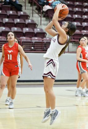 Littlefield junior, Cali Saldana (21), gets to the hoop for a wide open lay-up, during the first half of the Lady Cats’ district victory over the Denver City Fillies on Tuesday night. (Staff Photo by Derek Lopez)