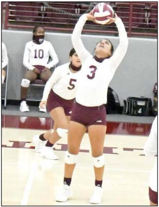 SETTING UP THE ATTACK – Littlefield senior captain, Geyah Garza, sets the ball up for one of her teammates to strike, during the first set of the Lady Cats’, 3-2, victory over Friona on Wednesday at Wildcat Gym. (Staff Photo by Derek Lopez)