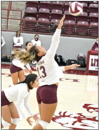 SETTING UP THE ATTACK – Littlefield sophomore, Kaeleigh Logan, goes up to deliver a kill attempt, during the first set of the Lady Cats’, 3-2, victory over Friona on Wednesday at Wildcat Gym. (Staff Photo by Derek Lopez)