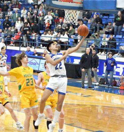 POINTS OFF TURNOVERS – Olton senior, Chris Urbina picks up a steal and takes it to the hoop for a transition lay-up with under one minute to play in regulation, during the Mustangs overtime victory over New Deal in the 2A Regional Quarterfinal game at Frenship’s Tiger Pit on Tuesday. (Staff Photo by Derek Lopez)