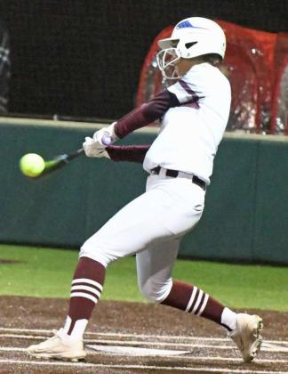 Littlefield senior, Myli Hernandez, rips a two-RBI double to center field to regain the lead for the Lady Cats, 13-12. These would end up being the game-winning runs, after the game was called due to weather in the bottom of the third inning on Tuesday. (Staff Photo by Derek Lopez)
