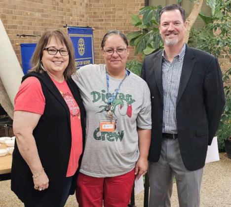 Reynalda Lopez-Silvas was honored as the Lamb Healthcare Center Employee of the Year on Tuesday in the LHC Atrium during their employee luncheon. Shown is Lopez-Silvas (Center) with Auxilary member Lori Durham (left) and LHC CEO Mike McNutt (right). (Staff Photo by Derek Lopez)