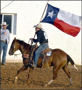 The Texas flag is presented at the opening of the WCRA rodeo in Earth Texas, on Friday, Sept. 15, 2023.