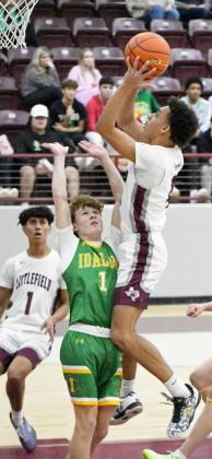Littlefield senior, Kam McCarty (4), gets to the bucket for a lay-up, during the first half of the Wildcat’s, 77-66, victory over Idalou in their first meeting of district play. (Staff Photo by Derek Lopez)