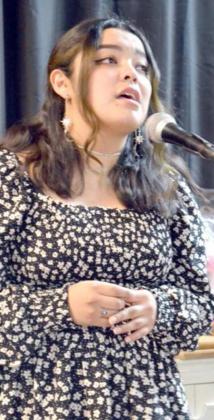 VERONICA TORRES Sang several songs, as Banquet guests ate their meal. (Staff Photo by Joella Lovvorn)