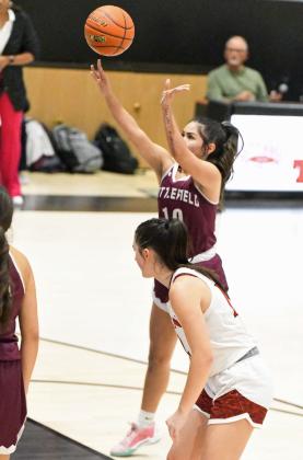Littlefield senior, Nevaeh Esquibel, drops in the second of two free throws late in the game, during the Lady Cats’ thrilling, 51-50, victory over the Tigerettes in Slaton on Tuesday. (Staff Photo by Derek Lopez)
