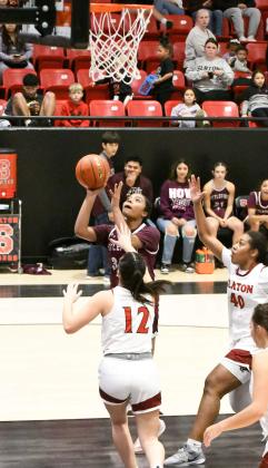 Littlefield freshman, Nia Cleveland, drops in a lay-up under the basket off of the assist from Amoni Jefferson, during the second half of the Lady Cats’ thrilling, 51-50, victory over the Tigerettes in Slaton on Tuesday. (Staff Photo by Derek Lopez)