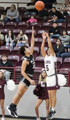Littlefield senior, Jeremiah Trevino (5), hits a step-back three from the left corner over a Muleshoe defender to close out the third quarter of the Wildcats, 53-42, home victory over the Mules on Friday at Wildcat Gym. (Staff Photo by Derek Lopez)