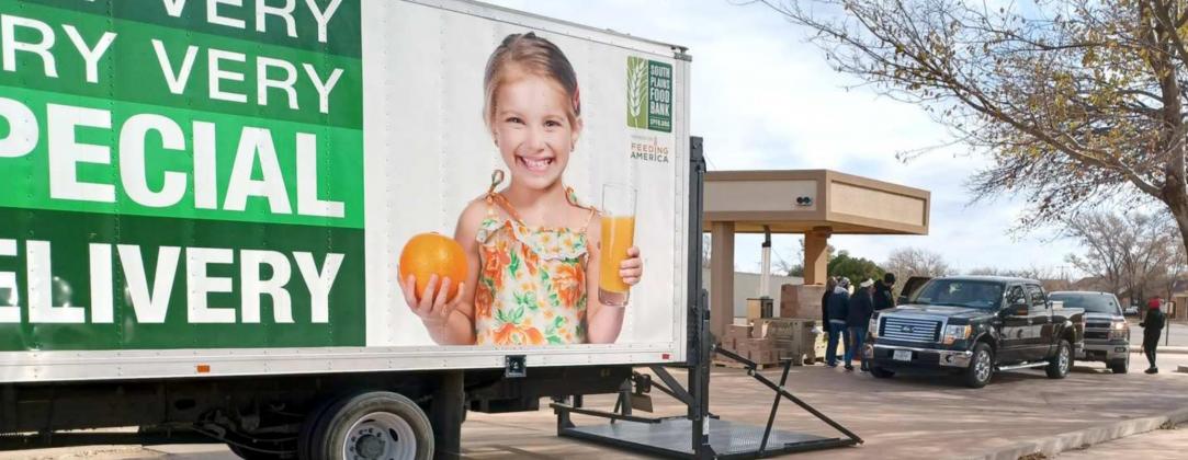 HANDING OUT FOOD BOXES