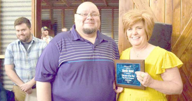 Left to right Elias Perez, presented the Educator of the Year Award to Shelli Rose at the Olton Chamber of Commerce Banquet held at The Home Place in Olton on March 4, 2023 as Wes Quigley, Chamber Office Manager, left, looks on (Photo by Ann Reagan)