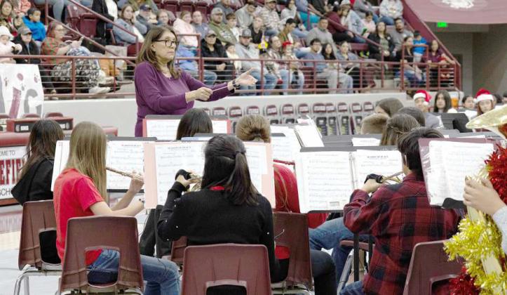 Band Director Gina Muela conducts the Littlefield Junior High Band at the Christmas Band Concert on Dec. 10, 2024. (Photo by Rhode Duenas)