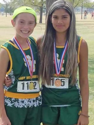 LEADING THE WAY – The Springlake-Earth Lady Wolverines’ cross country team competed at Plainview this past weekend. (L-R): Freshman, Taytum Goodman, placed first overall, while freshman DeDe Delgado finished 10 th overall. (Submitted Photo)