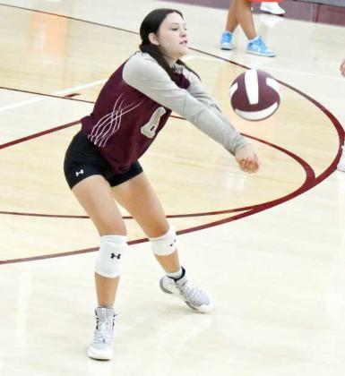 BREAKING THE SERVE - Littlefield libero, Maddie Brown, breaks the serve from LCHS, during the first set of their loss to the Lady Eagles on Tuesday at Wildcat Gymnasium. (Staff Photo by Derek Lopez)