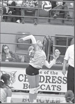 Littlefield sophomore, Madison Williams, goes up to deliver a hit, during the first set of the Lady Cat’s road loss to Childress on Tuesday night. (Staff Photo by Derek Lopez)