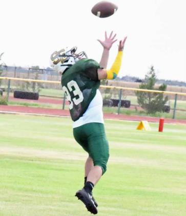 GOING THE OTHER WAY- Springlake-Earth’s Jerry Gallegos hauls in an over the shoulder interception during their first deffensive stand in their scrimmage on Thursday against Wildorado. (Staff Photo by Derek Lopez)