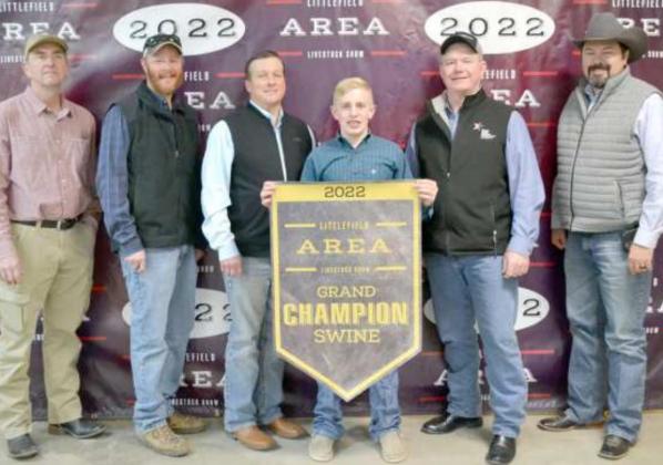 GRAND CHAMPION SWINE BUYERS for Rylan Brashear. Bidders represent Lamb County Farm Bureau, Texas Producers Cooperative, First Federal Bank, Sawyer Construction, Lance insurance, King Ag, Lamb County Electric Coop, Skyland Grain and Cotton, Tanner Heffington, Diversity D. and Adj. (Staff Photo by Joella Lovvorn)