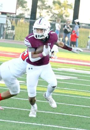 POSITIVE YARDS - Littlefield senior receiver, Javen Jimenez, picks up a solid gain around the left side, during the first half of the Wildcats’, 28-14, loss to the Cubs on Friday to close out the pre-district schedule. (Staff Photo by Derek Lopez)