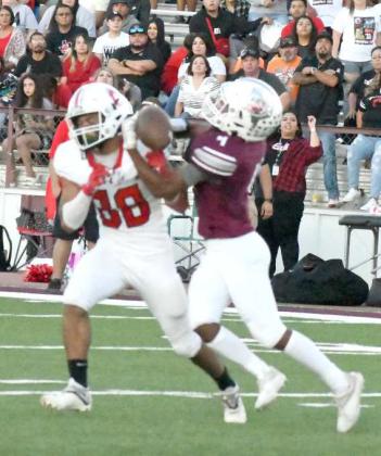 BREAKING UP THE PASS - Littlefield defensive back, MJ Randle, gets a hand in and breaks up a pass intended for Kaydyn Moore, during the first half of the Wildcats’, 28-14, loss to the Cubs on Friday to close out the pre-district schedule. (Staff Photo by Derek Lopez)
