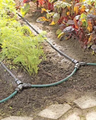 Snip-n-drip irrigation systems apply water directly where it is needed and fit any garden planted in rows. (Photo courtesy of Gardener’s Supply Company/gardeners.com)