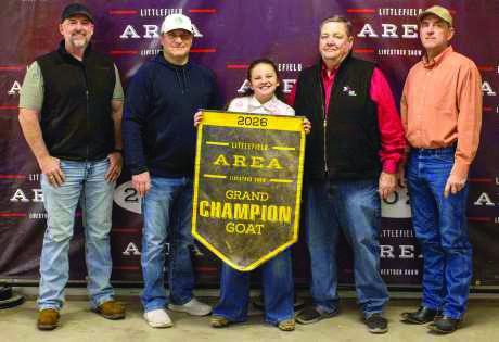 Grand Champion Goat winner Claire Senter poses with buyers from First United Bank, WDG Trucking, Lamb County Farm Bureau, Sawyer Construction, Kim and Shonda Black, RomCo Equipment, Texas Producers Co-Op, LB Home, Lowe's and The Syndicate.