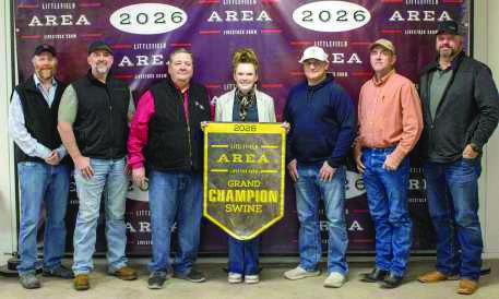 Grand Champion Swine winner Valaree Harper poses with buyers from First United Bank, Lance Insurance, Lamb County Bureau, Lowe's, Texas Producers Co-Op, 2B Harvesting, Sawyer Construction, Jarvis Metals, Diamond Rock Dairy, Sam Stevens Inc., Muleshoe Livestock, First State Bank, Ronnie Schroeder, Charles Schroeder, Kyle and Darleana Robertson, Graham and Christa Henley and the Figueroa Family.