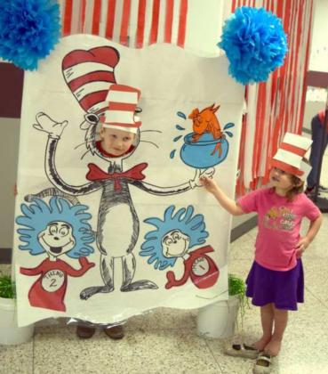 SIX-YEAR-OLD Gaege Merriam and his sister, Olivia Merrriam were having some fun at the Seussical reading event at Littlefield Primary School Monday evening, Feb. 28, 2022.(Photo by Ann Reagan)