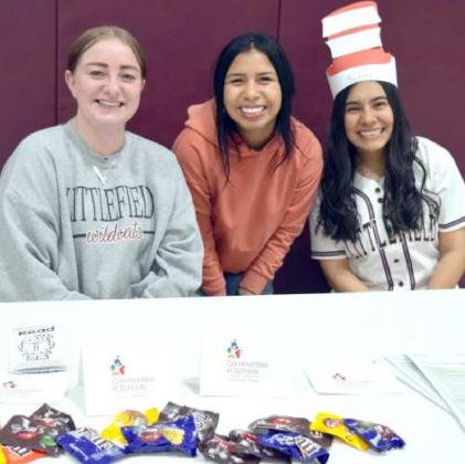 VOLUNTEER SERVERS from Littlefield High School’s Student Council served cookies and drinks during the Seussical reading Event Monday evening, Feb. 28, 2022 at Littlefield Primary School. (Photo by Ann Reagan)