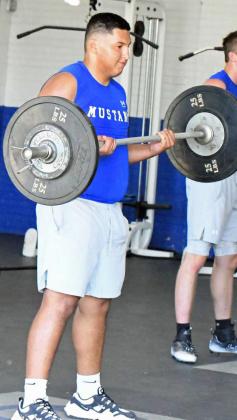 The Olton Mustangs’ varsity football team was putting in work on the field and in the weight room during the second day of two-a-days on Tuesday. (Staff Photo by Derek Lopez)