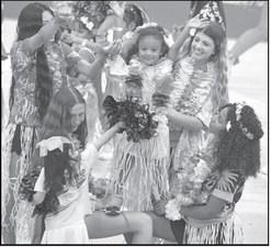 Campers work on their stunts, during Hawaii Day