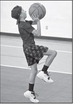 Campers work on lay-ups, during the Littlefield Basketball Camp that was held in June at the Elementary Gym. (Staff Photo by Derek Lopez)