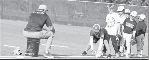 Campers worked on fielding and throwing skills at the Littlefield Baseball Camp that was held in June at Wildcat Field. (Staff Photo by Derek Lopez)