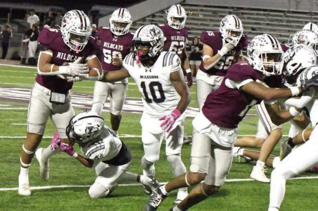 Littlefield junior running back, Blayton Soliz, picks up some tough yardage, during the second quarter of the Wildcats’, 50-26, victory over the Mules on Friday at Wildcat Stadium. (Staff Photo by Derek Lopez)