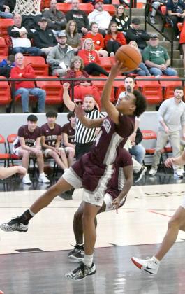 Kam McCarty drops in a lay-up in transition, during the second half of the Wildcats’ 51-46, loss on the road to Shallowater on Friday. (Staff Photo by Derek Lopez)