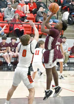 Eizeah Coleman drops in a baby-hook shot in the lane, during the second half of the Wildcats’ 51-46, loss on the road to Shallowater on Friday. (Staff Photo by Derek Lopez)