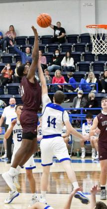 UP FOR TWO -Littlefield senior forward, Tyree Jones, puts up a floater over the Steers defender, during the first half of the Wildcats’ road loss to Farwell on Tuesday. (Staff Photo by Derek Lopez)