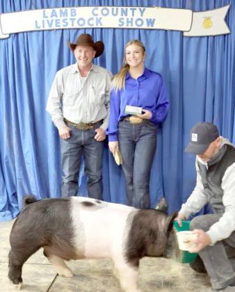 Brinley Magby of Sudan and her Pig earned Reserve Grand Champion Cross Pig at the Lamb County Junior Livestock Show that took place in Littlefield on Saturday. (Photo by Ann Reagan)