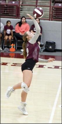 Littlefield’s Kennadi Hanlin sends a hit over the net, during the first set of the Lady Cats’ match with with River Road at Wildcat Gymnasium on Tuesday. (Staff Photo by Derek Lopez)