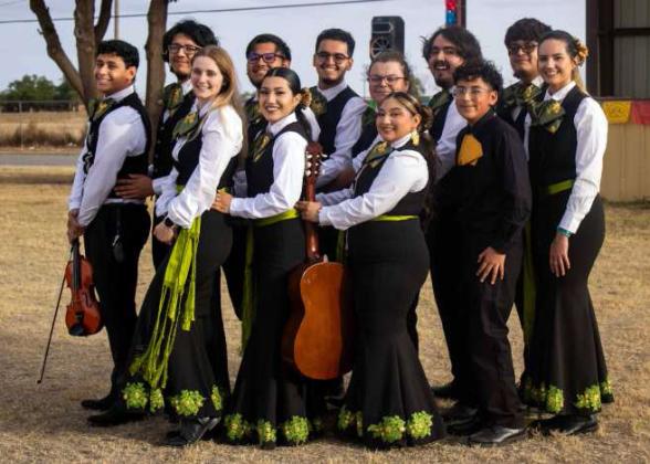 (Above right) Maria Monje, Marcos Rodriguez and Marcus Martinez win the Salsa Contest. (Left) Brandy Pollard wins the Grito Contest. (Right) Mariachi Akumal performs at the Cinco de Mayo event.