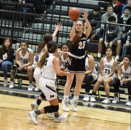 SHARP SHOOTING— Sudan sophomore, Gracyn Shultz (25), drains a three from the left wing, over the Muleshoe defense, during the first half of the Nettes’ victory over the Lady Mules on the road on Monday. (Staff Photo by Derek Lopez)