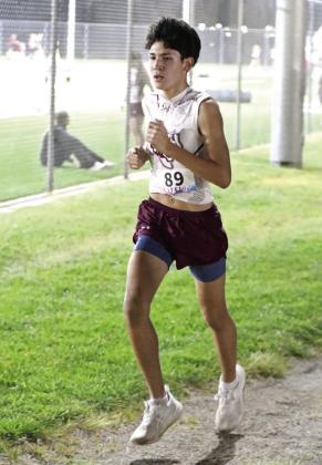 Angel Pacheco placed sixth overall in the varsity boy’s race at the WT Twilight Meet last Thursday in Canyon. (Staff Photo by Derek Lopez)