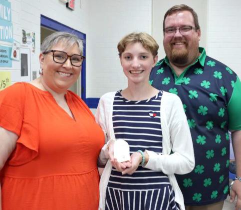 Presenting the First Silver Star award to Ezri Jobe, center, is Kathy Lostroh and Brandon Albus. (Photo by Ann Reagan)