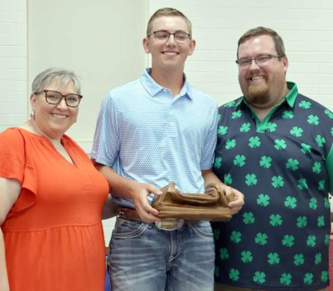 Presenting the Second Silver Star award to Grant Muller, center, is Kathy Lostroh and Brandon Albus. (Photo by Ann Reagan)