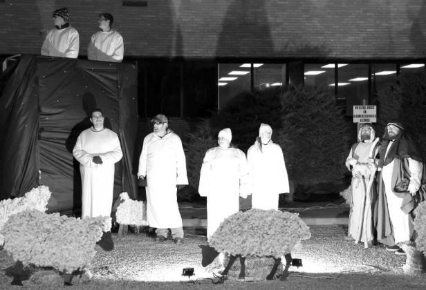Angels appear before the shepherds during the live Nativity scene presented by Trinity Church of Littlefield during the Christmas Tree Lighting held at the Courthouse Park on Monday December 1, 2025. (Photo by Ann Reagan)