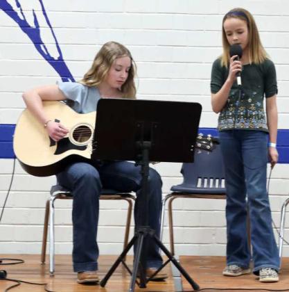 ENTERTAINING -- Left to right: Evelyn Meredith and Ellie McCasland perform'Here Comes the Sun' at the Olton Chamber of Commerce Banquet on Saturday, March 2, 2024. (Photo by Ann Reagan)