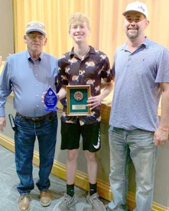 SWCD AREA 1 JUNIOR DIVISION WINNER -- Roy Thompson (left) and Jeff Edwards (right) presented Aspen Reyher of Sudan with the Third Place plaque on his essay from Area 1. (Submitted Photo)