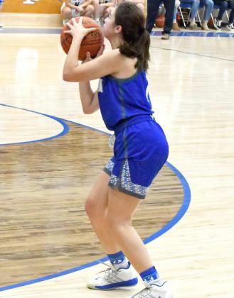 SHOOTING THE THREE — Olton junior, Celestte Ramirez (2), shoots a three from the left wing, during the second half of the Fillies’ road loss to the Lady Blue on Friday in district play. (Staff Photo by Derek Lopez)