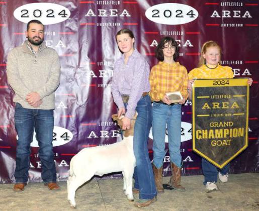 Kauy Carr of Sudan 4-H won Grand Champion Goat at the Littlefield Area Junior Livestock Show on Friday at the Lamb County Ag Center. Shown with Judge Walker Hemphill. (Photo by MD Creations)